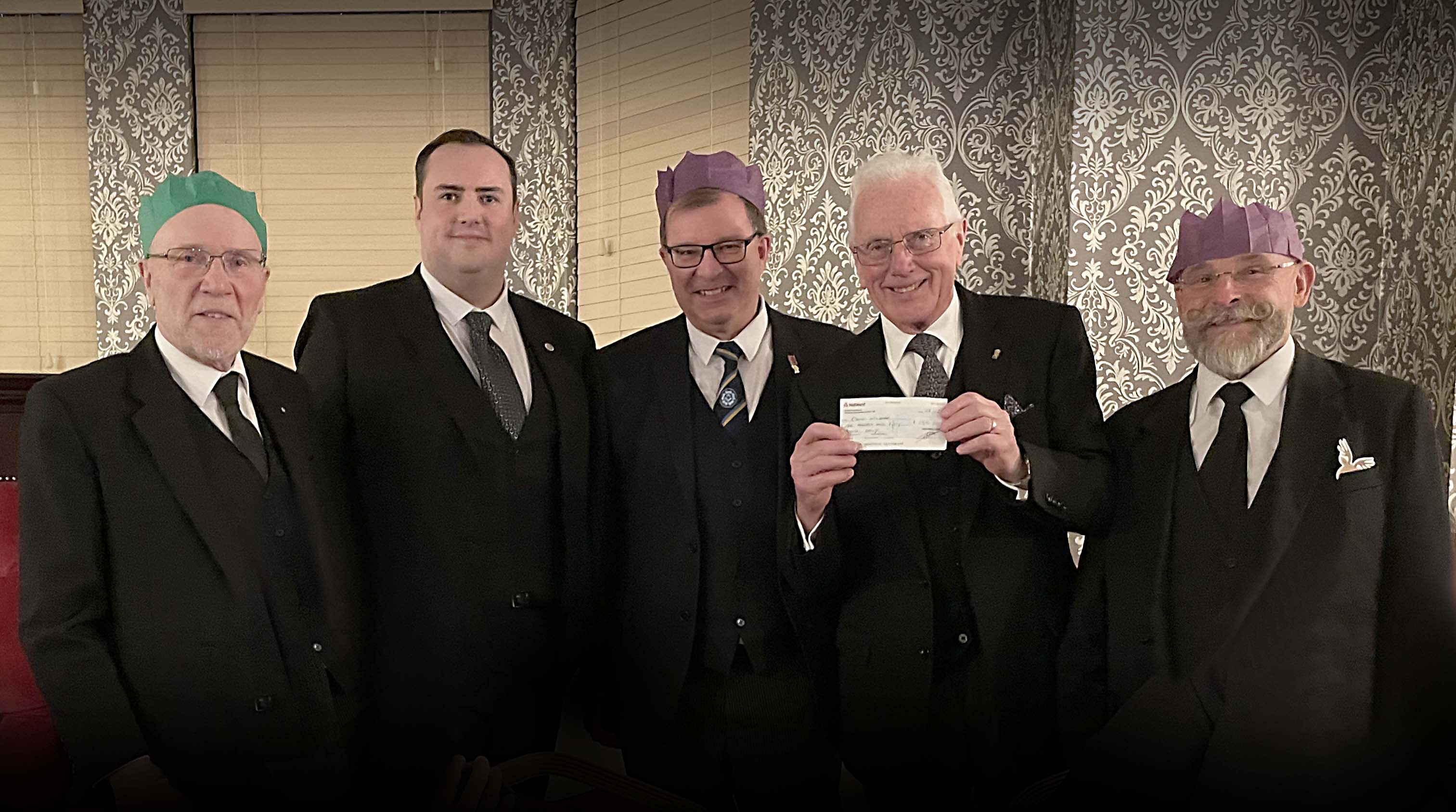The Master and Treasurer of Vigilantes Lodge presenting a cheque to The Daggards